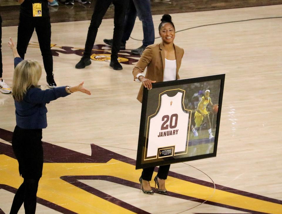 Former Arizona State guard Briann January smiles as head coach Charli Turner Thorne congratulates her ahead of her jersey retirement ceremony in Friday's game against Minnesota. 