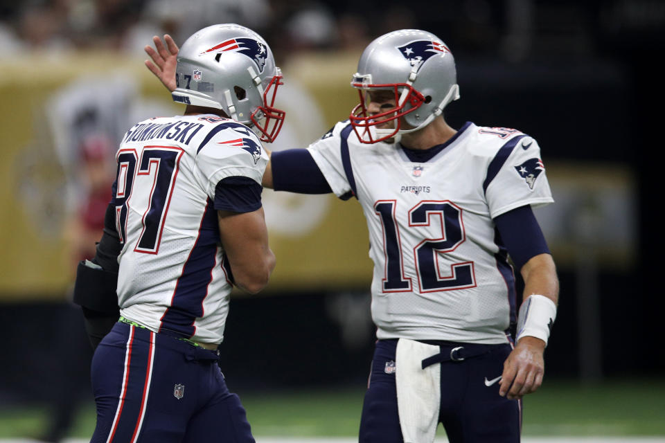 NEW ORLEANS, LA - SEPTEMBER 17:  Tom Brady #12 and  Rob Gronkowski #87 of the New England Patriots celebrate after a touchdown against the New Orleans Saints at the Mercedes-Benz Superdome on September 17, 2017 in New Orleans, Louisiana.  (Photo by Chris Graythen/Getty Images)