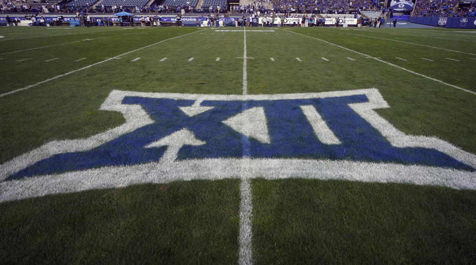 FILE - The logo for the Big 12 Conference has been applied to the field for an NCAA college football game between Sam Houston State and BYU, Sept. 2, 2023, in Provo, Utah. Big 12 schools will share in a record $470 million in revenue distribution, which the conference announced Friday, May 31, 2024, when wrapping up its first spring meetings as a 14-team league and before growing by two more teams. (AP Photo/Rick Bowmer, File)