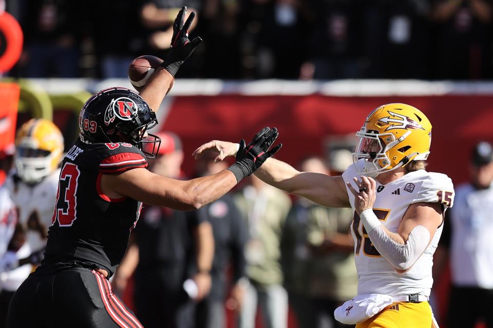 Nov 4, 2023; Salt Lake City, Utah, USA; Arizona State Sun Devils quarterback Jacob Conover (15) has pass deflected by Utah Utes defensive end Jonah Elliss (83) in the second quarter at Rice-Eccles Stadium. Mandatory Credit: Rob Gray-USA TODAY Sports