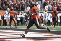 Oregon State running back B.J. Baylor (4) strides in to the end zone for a touchdown during the first half of an NCAA college football game against Idaho on Saturday, Sept. 18, 2021, in Corvallis, Ore. (AP Photo/Amanda Loman)