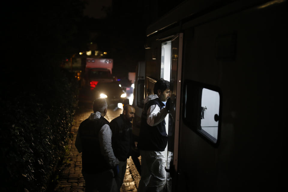 Turkish forensic officers arrive at the Saudi consulate to conduct a new search over the disappearance and alleged slaying of writer Jamal Khashoggi, in Istanbul, early Thursday, Oct. 18, 2018. Pro-government newspaper Yeni Safak on Wednesday said it had obtained audio recordings of the alleged killing of Saudi writer Khashoggi inside the consulate on Oct. 2. (AP Photo/Emrah Gurel)