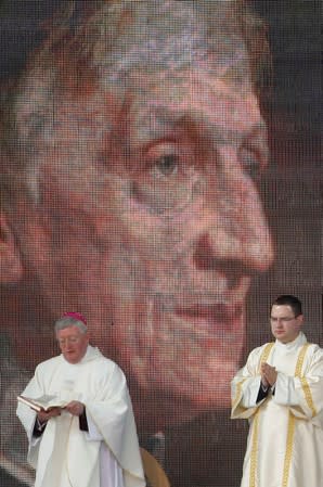 FILE PHOTO: An image of Cardinal John Henry Newman is seen above the stage during his beatification Mass attended by Pope Benedict XVI at Cofton Park in Birmingham, central England