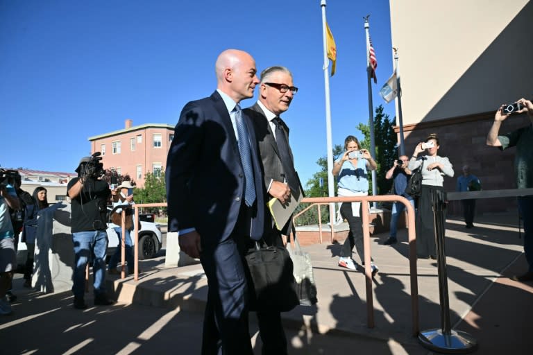 Alec Baldwin, accompanied by his lawyer, shot a glare at journalists before marching wordlessly on to the New Mexico courthouse (Frederic J. Brown)