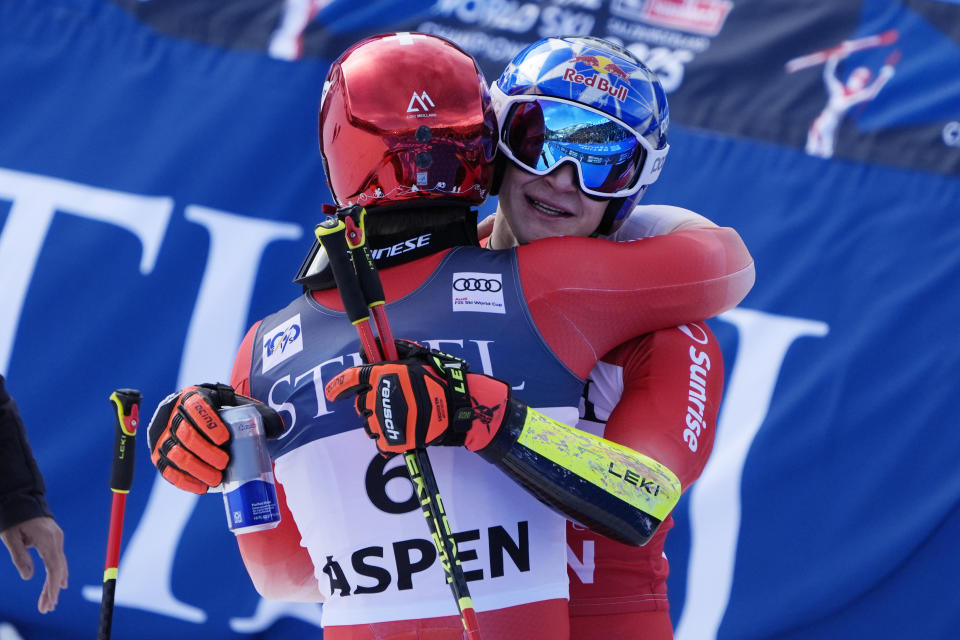 Switzerland's Marco Odermatt, right, celebrates his victory in a men's World Cup giant slalom skiing race with teammate Loic Meillard, the second place finisher, Saturday, March 2, 2024, in Aspen, Colo. (AP Photo/Robert F. Bukaty)