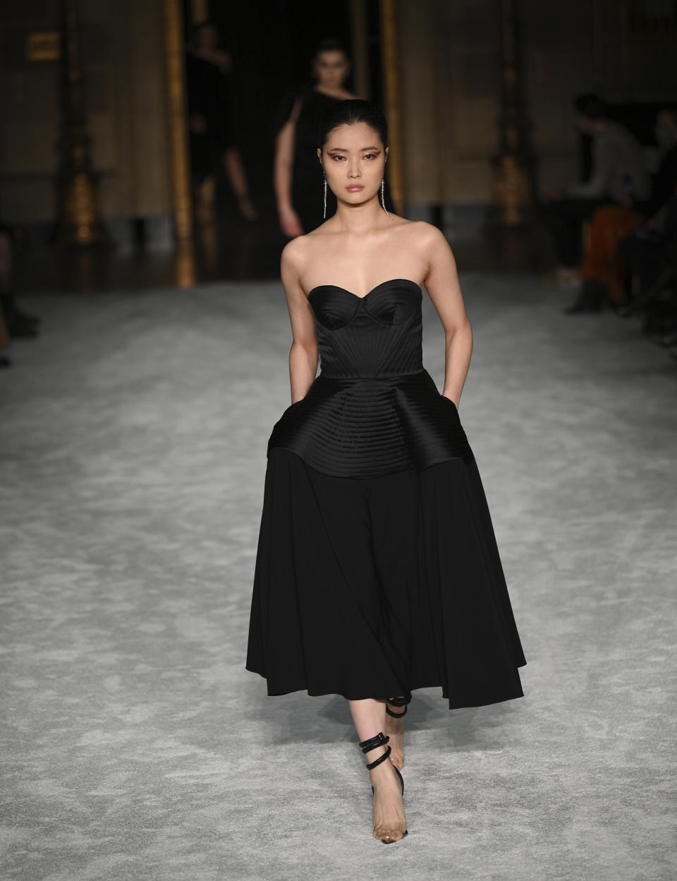 A model walks the runway at the Christian Siriano Fall/Winter 2021 at Gotham Hall during New York Fashion Week on Thursday, Feb. 25, 2021, in New York. (Photo by Evan Agostini/Invision/AP)