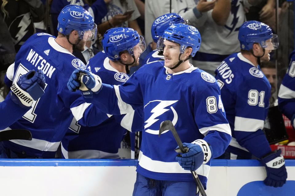 Tampa Bay Lightning left wing Tanner Jeannot (84) celebrates with the bench after his goal against the Edmonton Oilers during the third period of an NHL hockey game Saturday, Nov. 18, 2023, in Tampa, Fla. (AP Photo/Chris O'Meara)