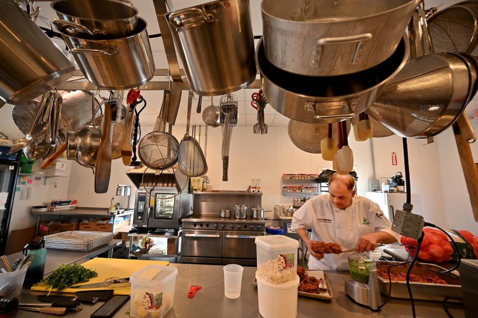 Farmer Matt's new executive chef John Steinhilber prepares ossobuco in the kitchen.