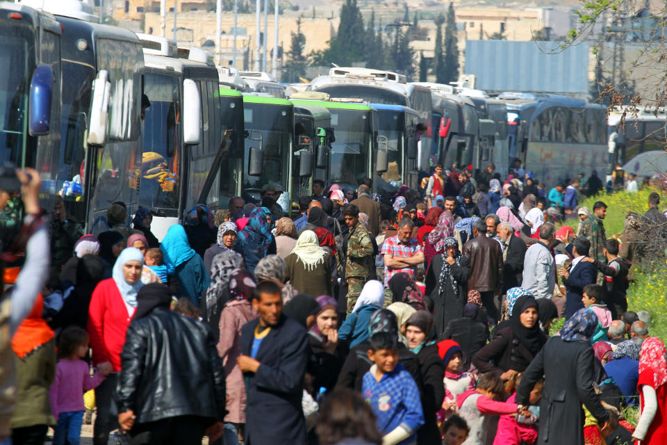 Evacuees from two Syrian villages wait near buses after a stall in an agreement between rebels and Syria’s army, at insurgent-held al-Rashideen on April 15. (Photo: Ammar Abdullah/Reuters)