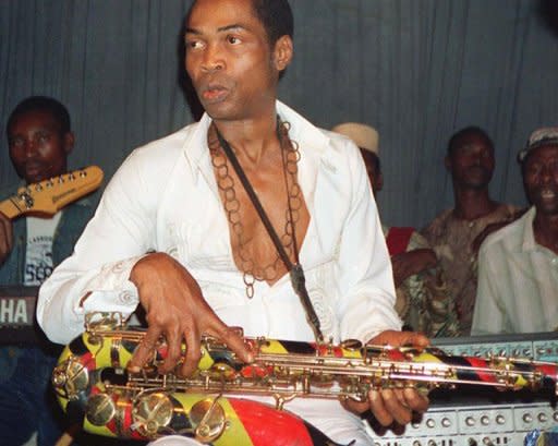 Fela Kuti plays in Lagos in 1988. The spirit of Fela Kuti haunts his old house -- the musician's colourful clothes in the bedroom, his shoes on a rack -- but the marijuana smoke, his many wives and his beguiling sax playing are long gone