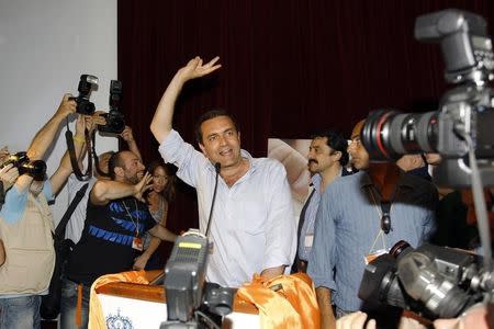 Luigi De Magistris celebrates winning at his campaign headquarters in Naples May 30, 2011. REUTERS/Ciro De Luca