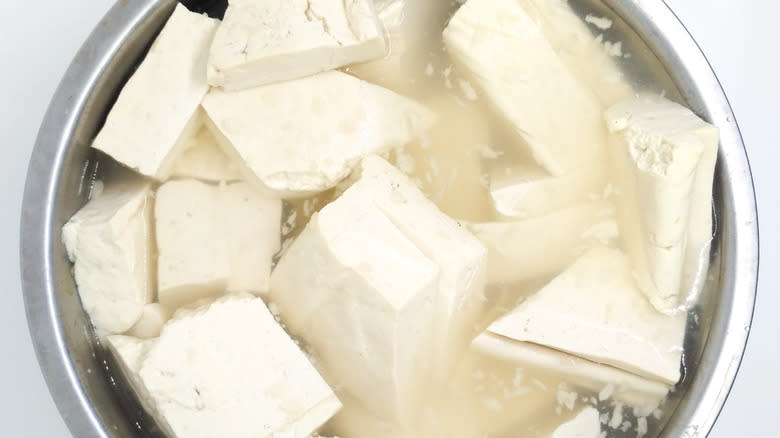 Tofu in an aluminium bowl