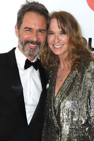 <p>Steve Granitz/FilmMagic</p> Eric McCormack and Janet Holden at the Elton John AIDS Foundation's 30th Annual Academy Awards Viewing Party on March 27, 2022 in West Hollywood, California.