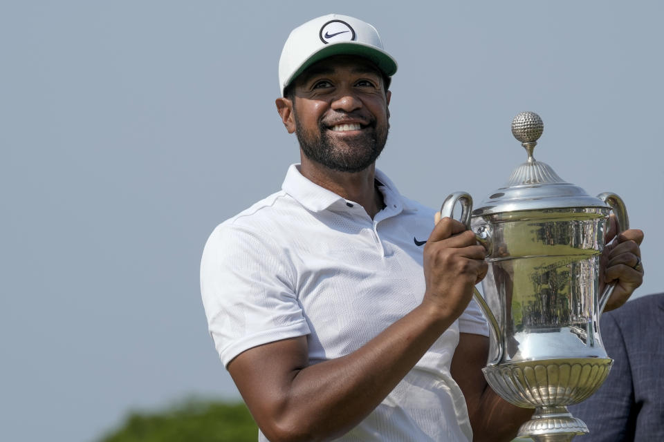 FILE - Tony Finau holds the championship trophy after his victory at the Mexico Open golf tournament in Puerto Vallarta, Mexico, Sunday, April 30, 2023. Finau is expected to compete in the PGA Championship next week at Oak Hill Country Club in Pittsford, N.Y.(AP Photo/Moises Castillo)