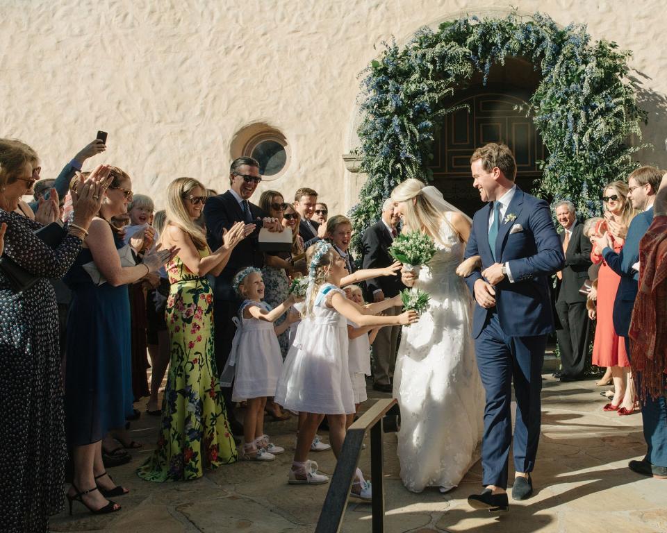 The bride combined California cool with English tradition, wore two Carolina Herrera dresses, and drove off in a vintage Porsche.