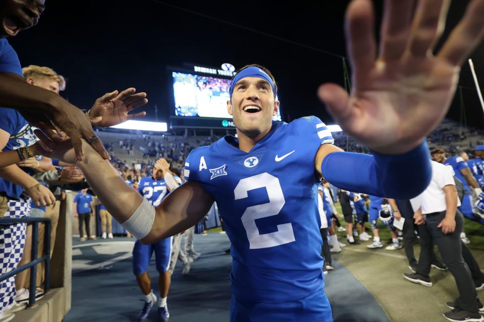 BYU players greet fans after winning a football game against the Cincinnati Bearcats at LaVell Edwards Stadium in Provo on Friday, Sept. 29, 2023. BYU won 35-27. | Kristin Murphy, Deseret News