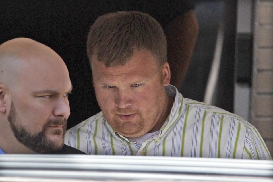 FILE - In this June 20, 2012 file photo, Matt Sandusky, right, the adopted son of former Penn State University assistant football coach Jerry Sandusky leaves the Centre County Courthouse in Bellefonte, Pa. Matt Sandusky is participating in the documentary "Happy Valley" about his father's sexual-abuse case to advocate for child sexual-abuse survivors. The 100-minute film is being screened this week at the Sundance Film Festival in Utah. Sandusky was expected to be a defense witness at Jerry Sandusky's trial but instead came forward to say that he had been abused by his adoptive father. Jerry Sandusky is appealing his conviction and 30- to 60-year prison term. (AP Photo/Gene J. Puskar, File)