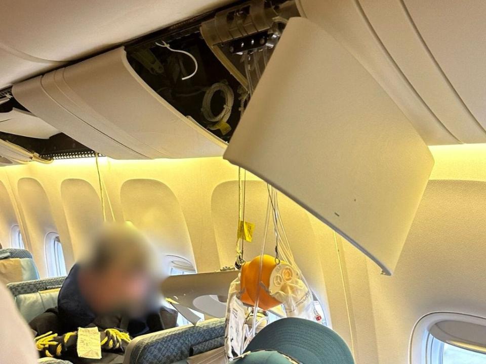 "I smashed into the ceiling so all the oxygen masks dropped in front of me as well," Tan said.