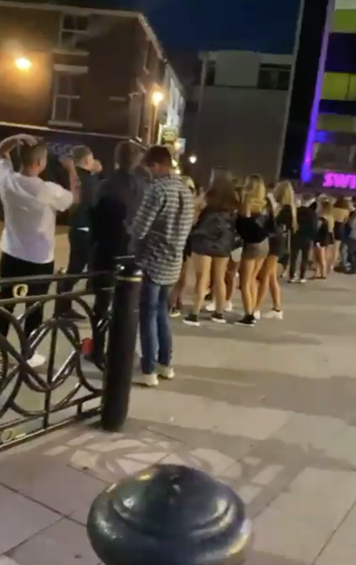 Footage shows revellers packed into a queue, leaving little room for social distancing (@Becky27808196/Twitter)