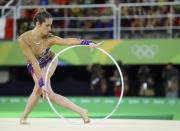 <p>Natalia Gaudio (BRA) of Brazil competes using the hoop. (Reuters) </p>