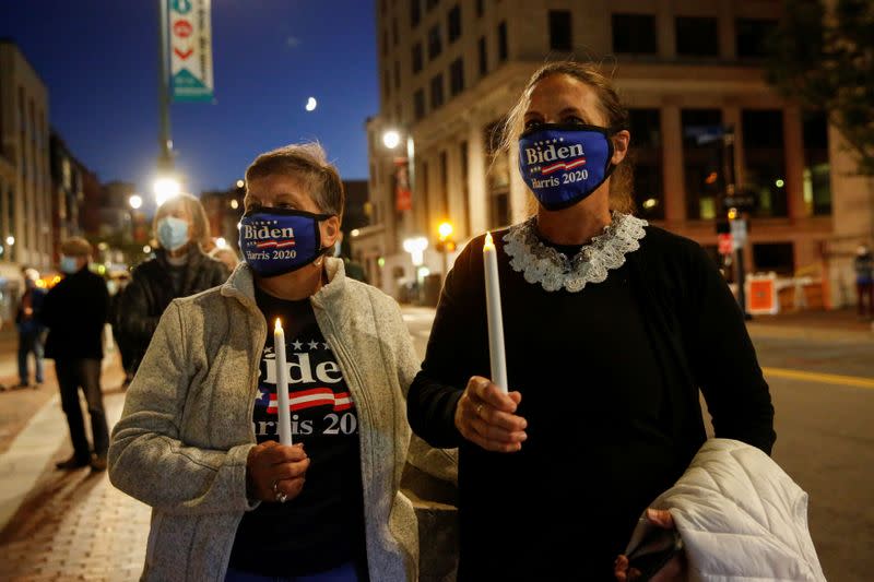 The late U.S. Supreme Court Justice Ruth Bader Ginsburg is mourned during a vigil in Monument Square in Portland, Maine