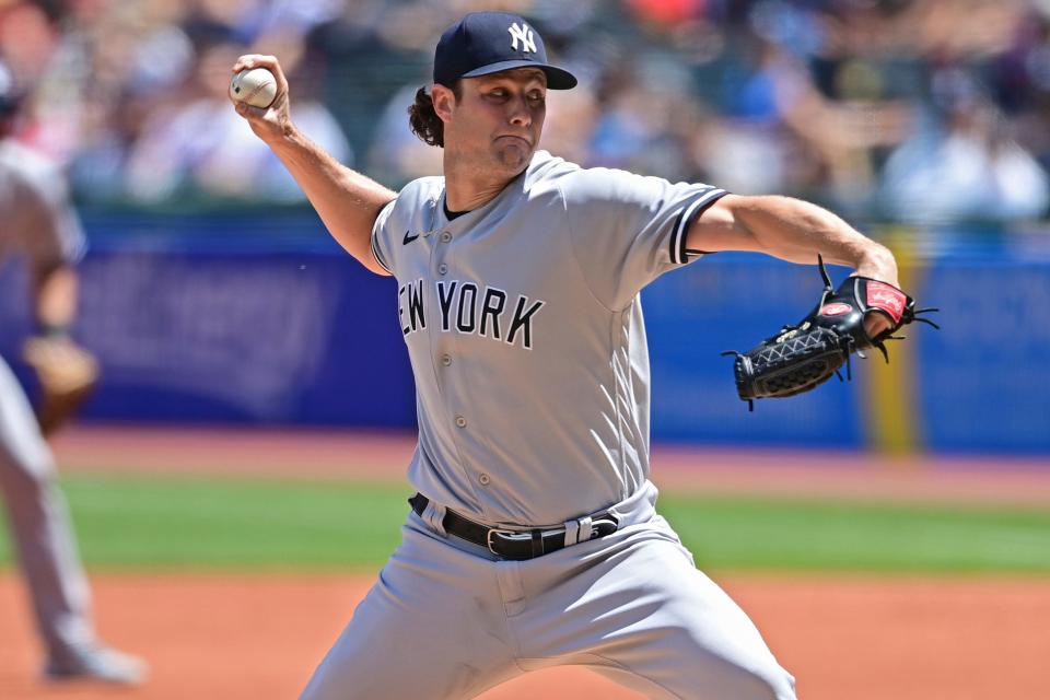 New York Yankees starting pitcher Gerrit Cole delivers in the first inning in the first baseball game of a doubleheader against the Cleveland Guardians, Saturday, July 1, 2022, in Cleveland. (AP Photo/David Dermer)