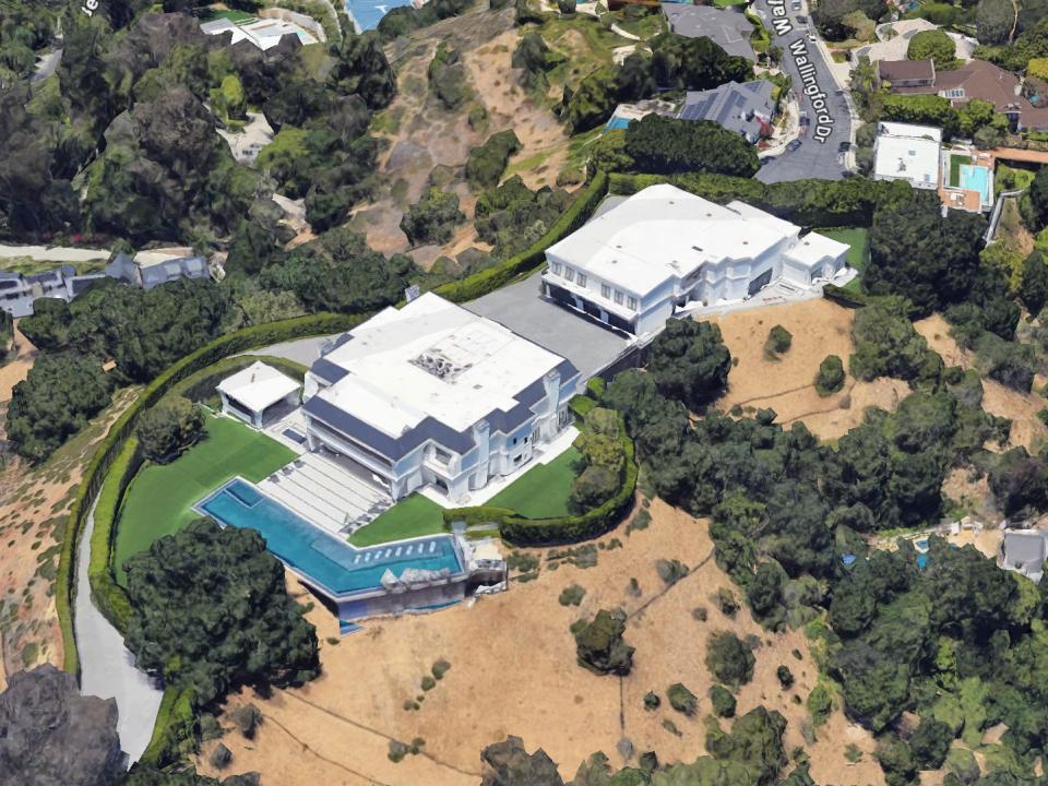 An aerial view of a white Beverly Hills mansion taken from Google Maps.