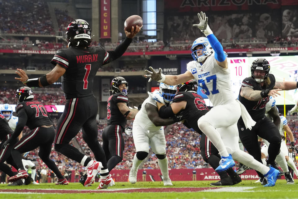 Detroit Lions defensive end Aidan Hutchinson (97) applies pressure to Arizona Cardinals quarterback Kyler Murray (1) during the second half of an NFL football game Sunday, Sept. 22, 2024, in Glendale, Ariz. (AP Photo/Ross D. Franklin)