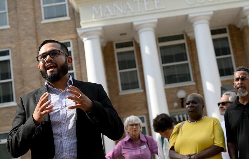 Cesar CJ Garcia shares his concern for the effects of legislation signed by Gov. Ron DeSantis during a press conference at the Manatee County Historic Courthouse Friday. The press conference was organized by the Manatee County Democratic Party to protest the recently passed immigration bill SB 1718.