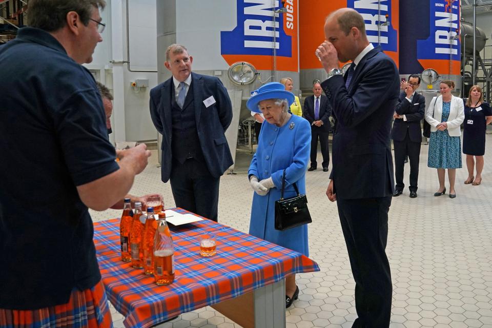 Britain's Prince William, Duke of Cambridge, (R) samples Irn-Bru as he and Britain's Queen Elizabeth II  visit AG Barr's factory in Cumbernauld, east of Glasgow, where the Irn-Bru drink is manufactured on June 28, 2021. - The Queen is in Scotland for Royal Week where she will be undertaking a range of engagements celebrating community, innovation and history. (Photo by Andrew Milligan / POOL / AFP) (Photo by ANDREW MILLIGAN/POOL/AFP via Getty Images)