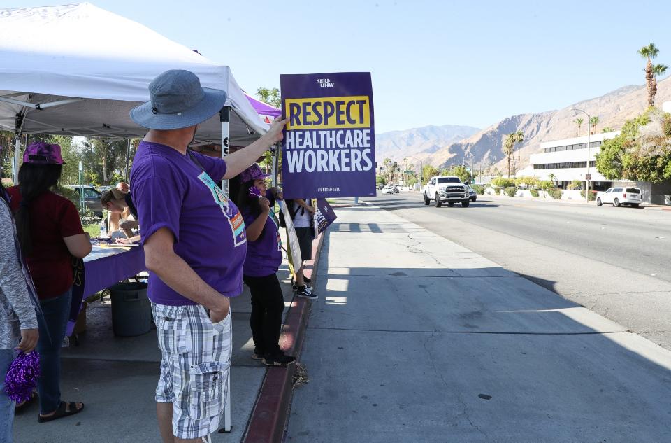 Healthcare workers picket outside of Desert Regional Medical Center in Palm Springs, Calif., July 25, 2023. 