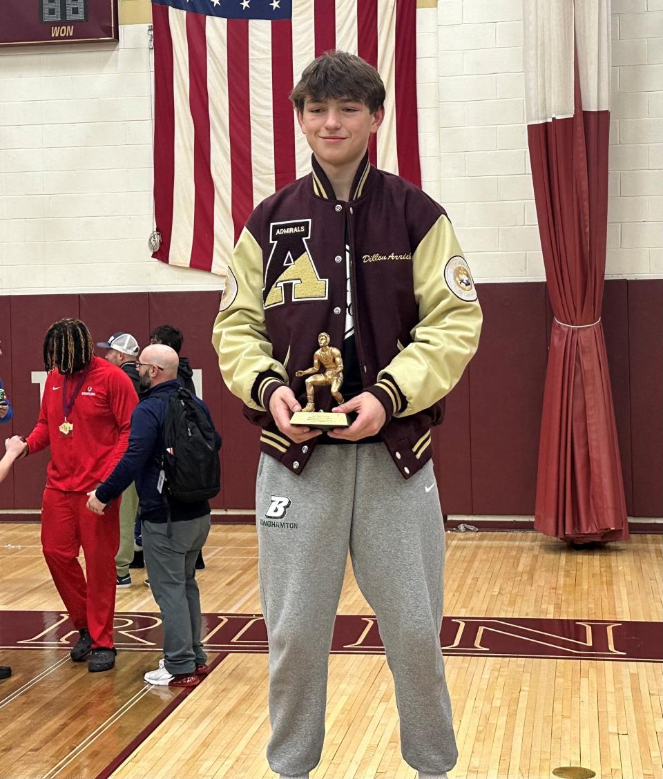 Arlington senior Dillon Arrick stands atop the podium with his Most Outstanding Wrestler award after winning the 124-pound circuit of the Mid Hudson Wrestling Tournament on Dec. 28, 2023 at Arlington High School.