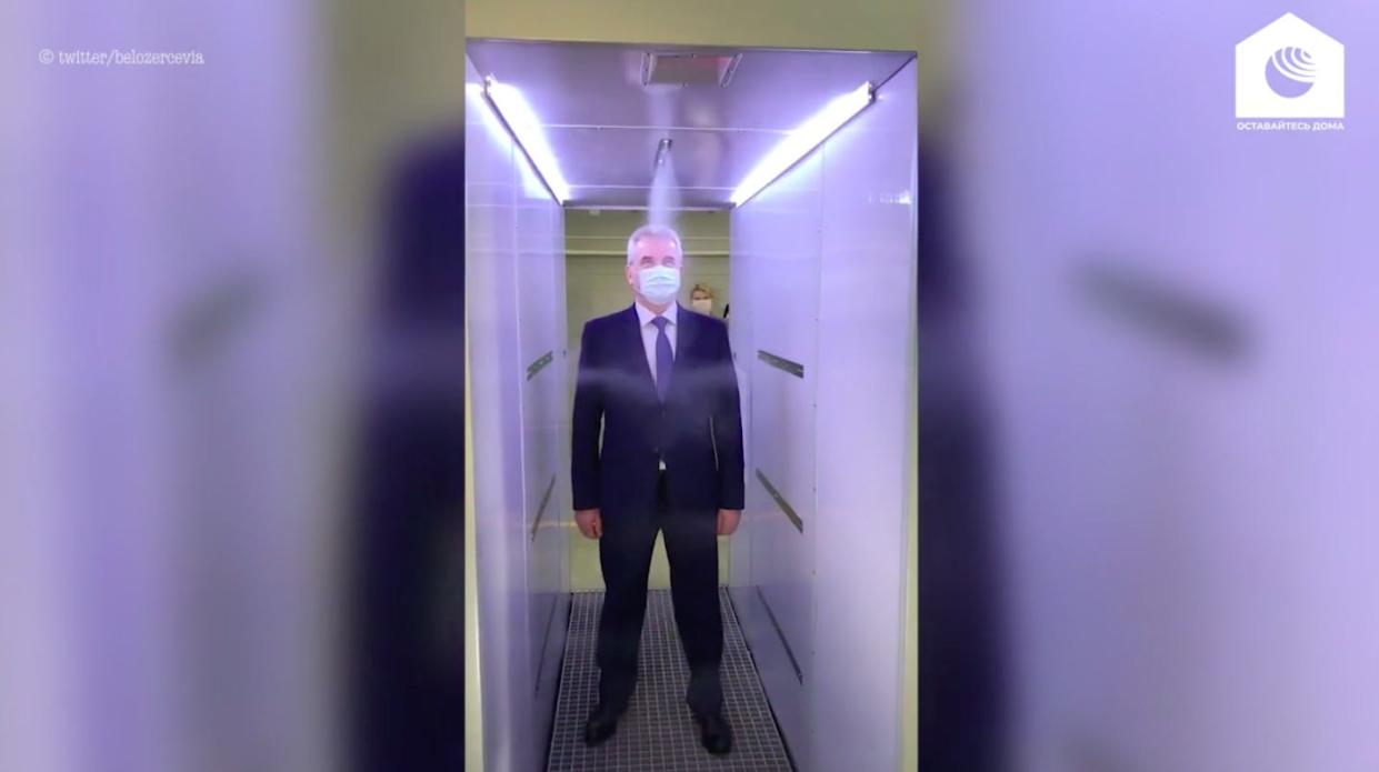 A still from a video from RIA Novosti showing the disinfectant tunnel that is installed at Putin's residence west of Mosow.