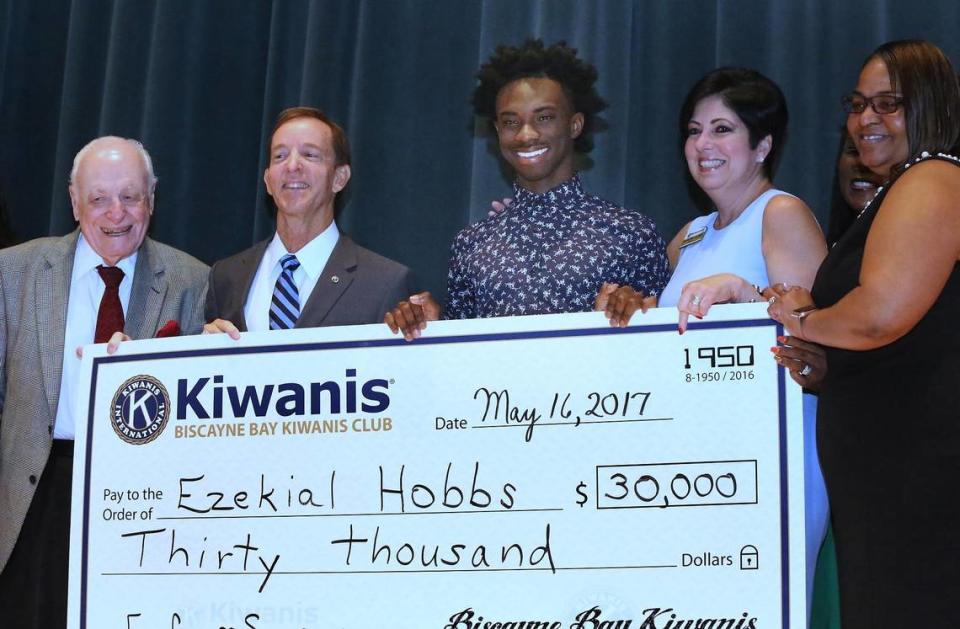 In this file photo from May 16, 2017, Ezekial Hobbs (center) poses with a check following the announcement that he had won a four year, full college scholarship from Biscayne Bay Kiwanis Club to attend Florida A&M where he planned to study journalism. Pictured from left to right are, Stanley Tate, founder of the Florida Prepaid College Plan, Rick Freedman, chairman of the Biscayne Bay Kiwanis Club’s Scholarship Committee, Ezekiel Hobbs, Nellie Hernandez, president of the Biscayne Bay Kiwanis Club and Vyonda Moss, Key Club Sponsor.