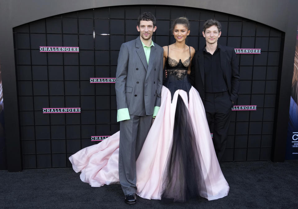 From left, Josh O'Connor, Zendaya and Mike Faist, cast members in "Challengers," pose together at the premiere of the film at the Regency Village Theatre, Tuesday, April 16, 2024, in Los Angeles. (AP Photo/Chris Pizzello)