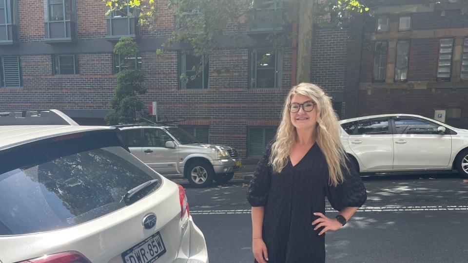 Charlotte Ward in a carpark. She makes money through the sharing economy via the Parkhound app. 