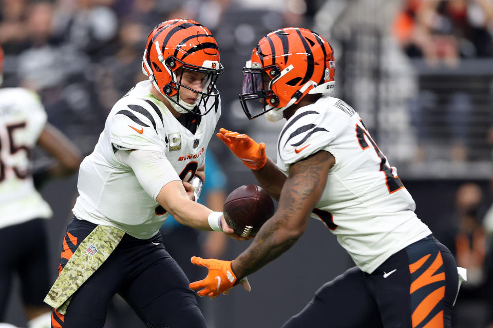 LAS VEGAS, NEVADA - NOVEMBER 21: Joe Burrow #9 of the Cincinnati Bengals hands the ball off to Joe Mixon #28 of the Cincinnati Bengals in the game against the Las Vegas Raiders during the first quarter at Allegiant Stadium on November 21, 2021 in Las Vegas, Nevada. (Photo by Matthew Stockman/Getty Images)