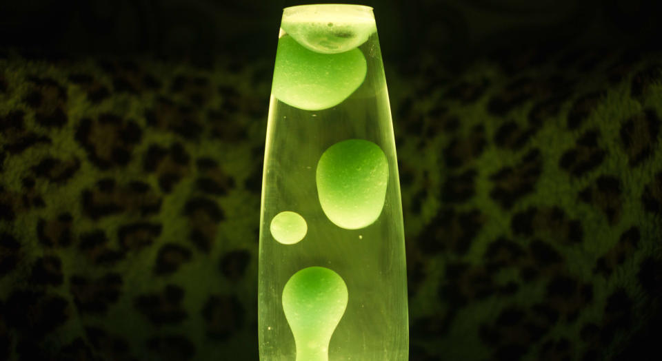 Lime green lava lamp in dark light