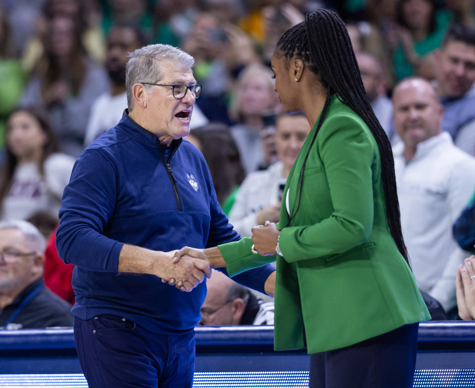 SOUTH BEND, IN - DECEMBER 04: Head coach Geno Auriemma of the UConn Huskies meets with Head coach Niele Ivey of the Notre Dame Fighting Irish after the game  at Joyce Center on December 4, 2022 in South Bend, Indiana. (Photo by Michael Hickey/Getty Images) 