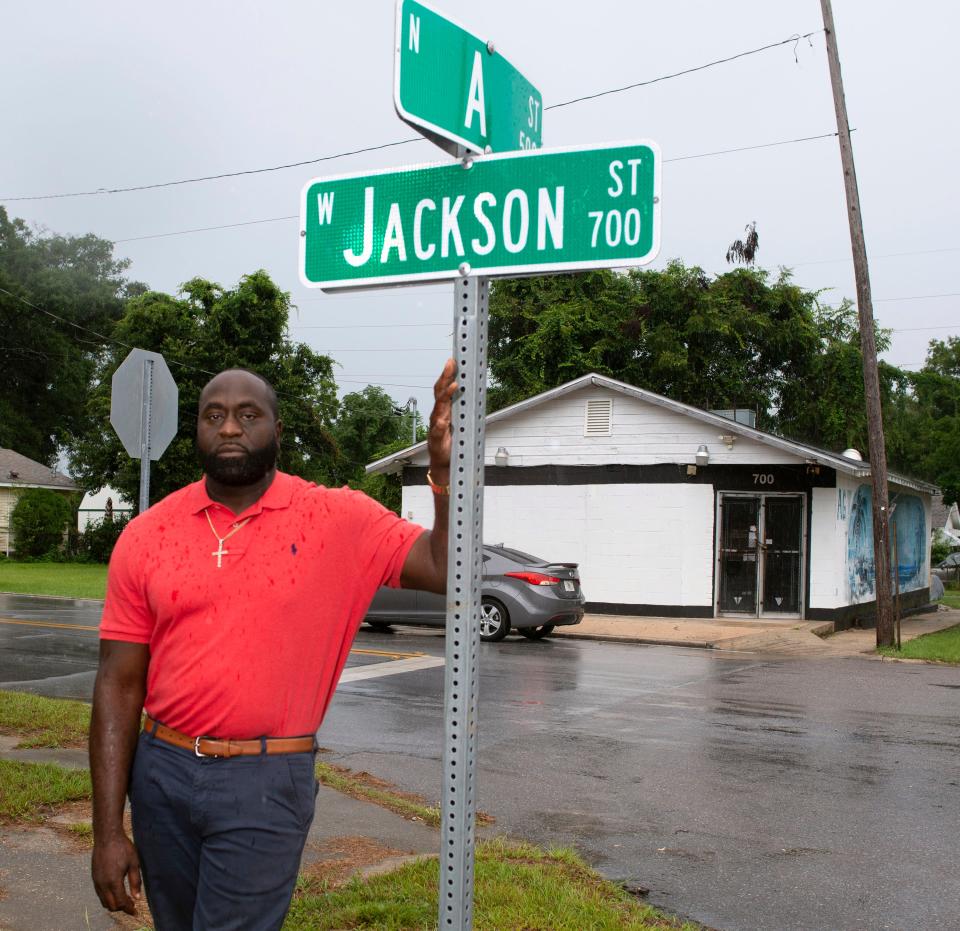 Hassan Hills, founder of the new nonprofit Youths Left Behind Corp., stands on the corner of the A and Jackson streets in Pensacola where in his own youth he sold drugs. He's now working to empower the community that he says he once "helped to destory."