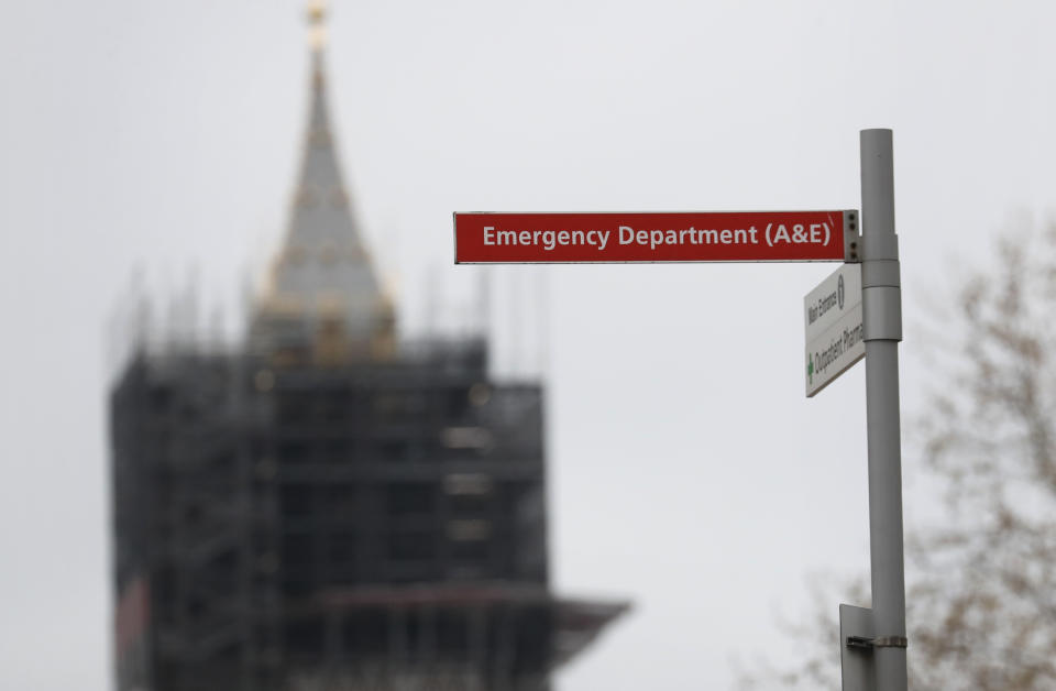 A hospital emergency sign is seen in front of the Queen Elizabeth Tower housing the Big Ben clock in Westminster, near where it is believed that Britain's Prime Minister Boris Johnson is undergoing tests after suffering from coronavirus symptoms, in London, Monday, April 6, 2020. British Prime Minister Boris Johnson has been admitted to a hospital with the coronavirus. Johnson's office says he is being admitted for tests because he still has symptoms 10 days after testing positive for the virus. (AP Photo/Frank Augstein)