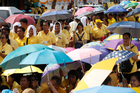 People stand in line to pass through a security check before attending a coronation procession for Thailand's newly crowned King Maha Vajiralongkorn near the Grand Palace in Bangkok, Thailand May 5, 2019. REUTERS/Soe Zeya Tun