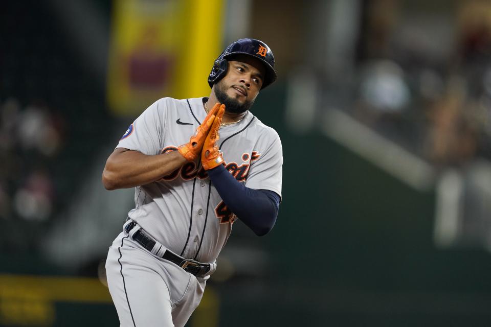 Detroit Tigers' Jeimer Candelario celebrates his two-run home run as he rounds third i nthe second inning of a baseball game against the Texas Rangers in Arlington, Texas, Sunday, Aug. 28, 2022. (AP Photo/Tony Gutierrez)