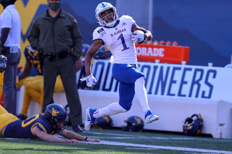 Evan Staley is unable to make the tackle on Jayhawks running back Pooka Williams Jr. as Williams Jr. scored on a 92-yard kickoff return.