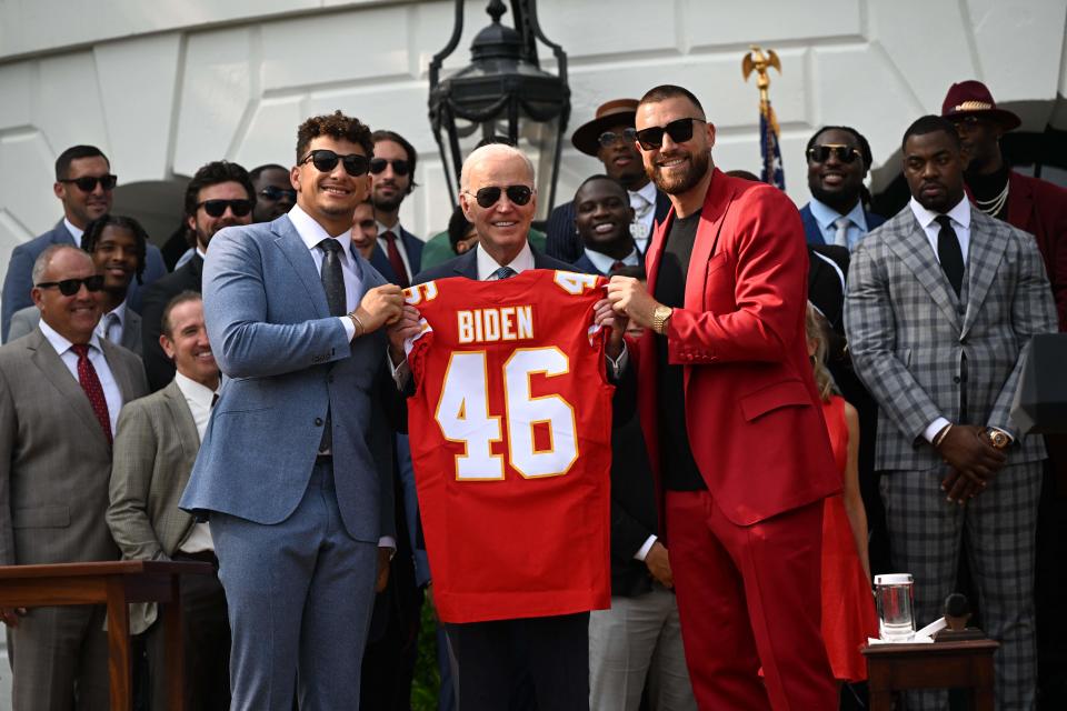 Kansas City Chiefs tight end Travis Kelce and quarterback Patrick Mahomes present US President Joe Biden with a jersey during a celebration for the Kansas City Chiefs, 2023 Super Bowl champions, on the South Lawn of the White House in Washington, DC, on June 5, 2023. (Photo by ANDREW CABALLERO-REYNOLDS / AFP) (Photo by ANDREW CABALLERO-REYNOLDS/AFP via Getty Images)