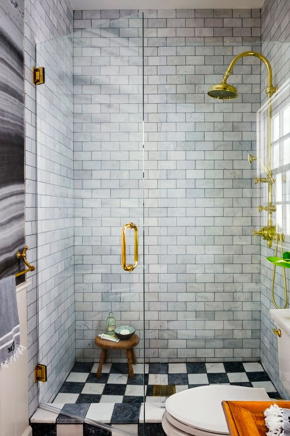 shower with black and white checkerboard tile floor