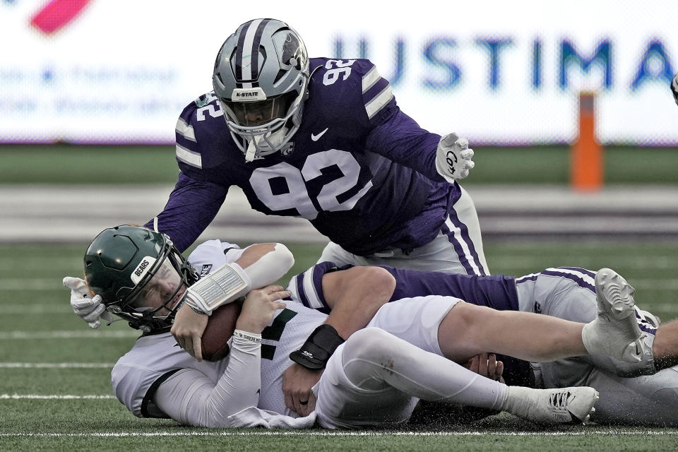 Baylor quarterback Blake Shapen (12) is tackled by Kansas State defensive tackle Jevon Banks (92) during the first half of an NCAA college football game Saturday, Nov. 11, 2023, in Manhattan, Kan. (AP Photo/Charlie Riedel)