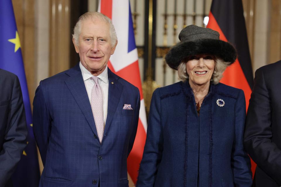 The invitation for King Charles' coronation refers to his wife as Queen Camilla for the first time. Here the royal couple visits Hamburg, Germany on March 31, 2023.