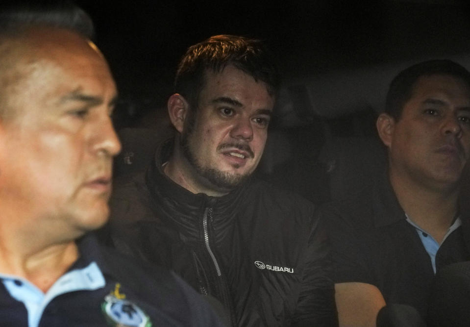 FILE - Dutch citizen Joran van der Sloot is driven in a police vehicle from a maximum-security prison to an airport to be extradited to the U.S., on the outskirts of Lima, Peru, Thursday, June 8, 2023. Van der Sloot, the chief suspect in Natalee Holloway’s 2005 disappearance, is scheduled to appear in court Wednesday morning, Oct. 18, where he is expected to plead guilty to trying to extort money from her mother and provide new information about what happened to the missing teen. (AP Photo/Martin Mejia, File)