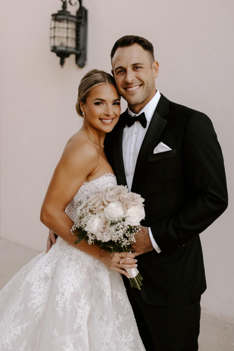 A portrait of a bride and groom on their wedding day.